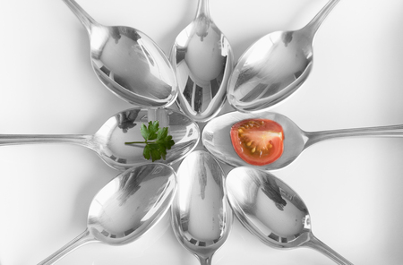 spoons, tomatoes and parsleyの写真素材