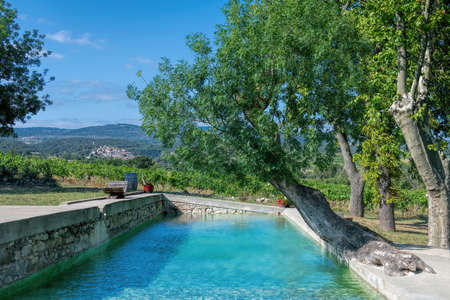 natural swimming pool with blue green waterの写真素材