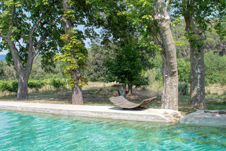natural swimming pool with blue green waterの写真素材