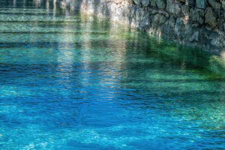 natural swimming pool with blue green waterの写真素材