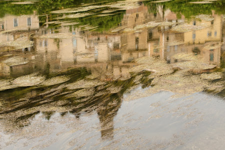 reflection of a village in a riverの写真素材