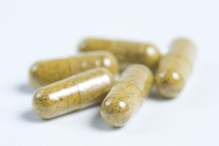 herbal pills on white backgroundの写真素材