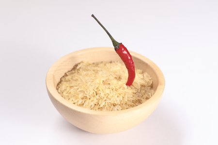 uncooked rice and red pepperの写真素材