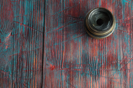 Old lens from old camera on the wooden tableの写真素材