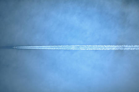 Airplanes leaves trace on sky.の写真素材