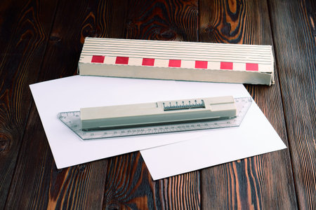 Rolling t-square protractor and the white paper.
