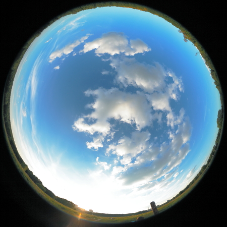 Around on Sky. Taken with a fisheye lens to give the special plate effect. The fresh air feel and clear blue sky are shown on the picture.の写真素材