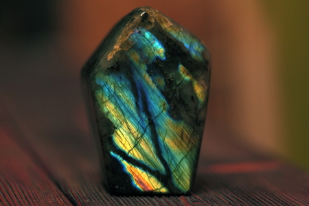 Polished blue labradorite on wooden backgroundの写真素材