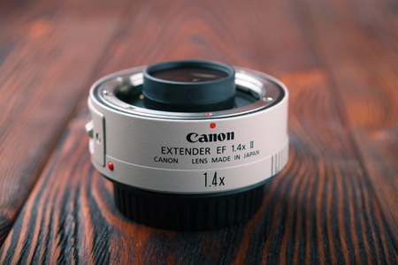 MOSCOW, RUSSIA, APRIL 21, 2017. CANON Extender EF 1.4 X II on a wooden backgroundのeditorial素材