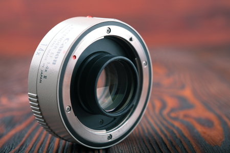 MOSCOW, RUSSIA, APRIL 21, 2017. CANON Extender EF 1.4 X II on a wooden backgroundのeditorial素材