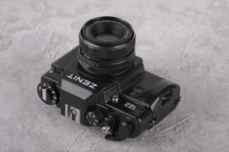 MOSCOW, RUSSIA, MAY 14, 2017. The old Soviet 35 mm SLR camera Zenit 122, released 1997, on cement background.のeditorial素材