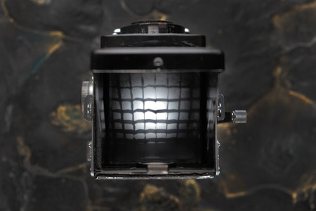 MOSCOW, RUSSIA, MAY 28, 2017. The old German medium-format TLR camera Rolleiflex, released1938 on lava background. Rolleiflex Automat 6x6 - Model RF 111A.のeditorial素材