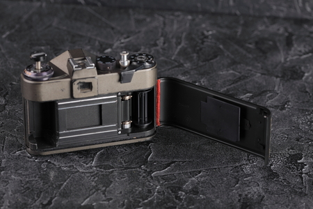 MOSCOW, RUSSIA, JANUARY 14, 2018. The old Soviet 35 mm SLR camera Zenit ET, released 1991 on black cement background.のeditorial素材