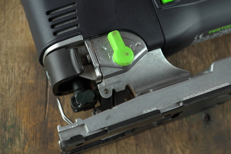 MOSCOW, RUSSIA, AUGUST 15, 2018. Electric jig saw Festool Trion PS 300 EQ on a wooden table against a brick wall.のeditorial素材