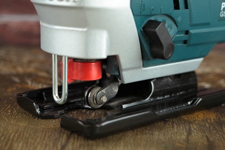 MOSCOW, RUSSIA, AUGUST 18, 2018. electric jig saw Bosch Professional GST 8000 E on a wooden table against a brick wall.のeditorial素材