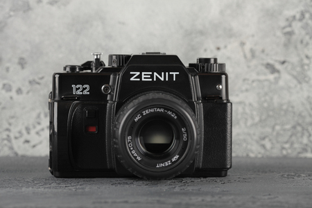 MOSCOW, RUSSIA, NOVEMBER 29, 2018. The old Soviet 35 mm SLR camera Zenit 122, released 1997, on a gray cement background. Limited edition for the 850th anniversary of Moscow.のeditorial素材