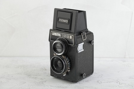 MOSCOW, RUSSIA, MARCH 30, 2019. The old Soviet medium format film TLR camera Lubitel-166B, released 1987 on white cement background. Amateur.のeditorial素材