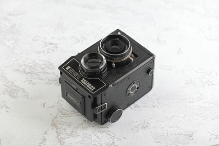 MOSCOW, RUSSIA, MARCH 30, 2019. The old Soviet medium format film TLR camera Lubitel-166B, released 1987 on white cement background. Amateur.のeditorial素材