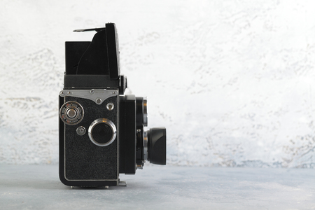 MOSCOW, RUSSIA, APRIL 5, 2019. The old Japan medium format film TLR camera Yashicaflex Model-C, released 1955 on white cement background.のeditorial素材