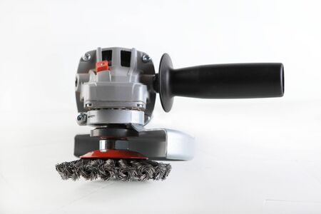 Angle Grinder Bosch GWS 9-125 s on white cement background. Bosch tools.のeditorial素材