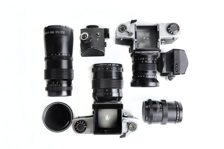 Two old Medium format SLR Film camera with vintage lenses on white background