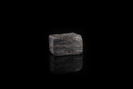 Metamorphic rock specimen, Russia on black glass background.の写真素材
