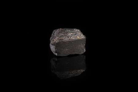 Metamorphic rock specimen, Russia on black glass background.の写真素材