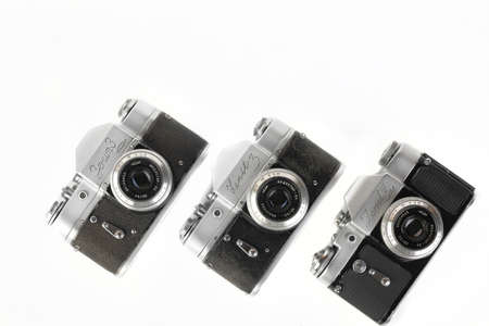 MOSCOW, RUSSIA, NOVEMBER 20, 2021. Very rare old Soviet 35 mm SLR cameras Zenit-3 and Zenit-3M, export version, released 1961, 1962, 1966 on white background.のeditorial素材