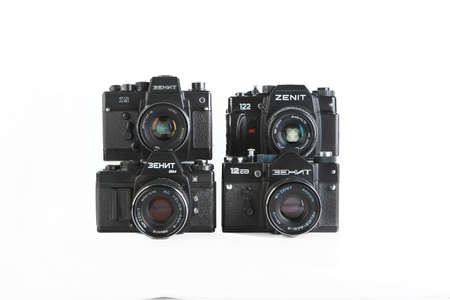 MOSCOW, RUSSIA, NOVEMBER 30, 2021. Very rare old Soviet 35 mm SLR camera Zenit 19, Zenit-AM, Zenit 12, Zenit 122, released 1983, 1993, 1991, 1997 on white background.のeditorial素材