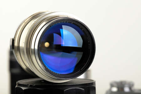 Jupiter-9 lens for an old Soviet rangefinder film camera Contax-2, Kiev-4A, 1973 release on a white background.のeditorial素材