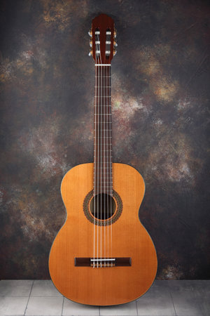 Mahogany classical guitar on vintage background.の写真素材