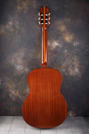 Mahogany classical guitar on vintage background.の写真素材