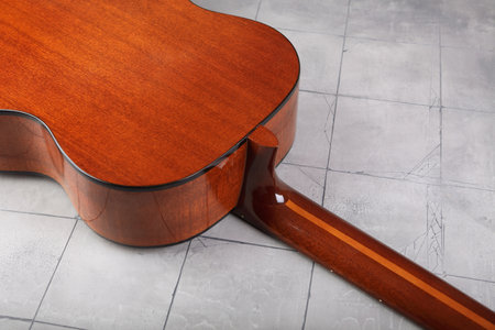 Mahogany classical guitar on vintage background.の写真素材