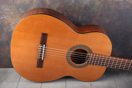 Mahogany classical guitar on vintage background.の写真素材