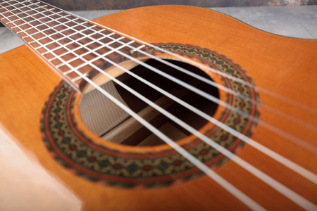 Mahogany classical guitar on vintage background.の写真素材