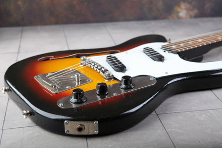 MOSCOW, RUSSIA, JULY 31, 2023. Vintage electric guitar Joana Iris released in 1988 on plastered background.のeditorial素材
