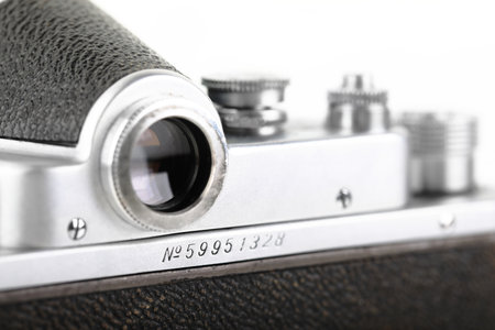 Vintage Soviet 35 mm SLR camera Zenit C, released1959 on white background.のeditorial素材
