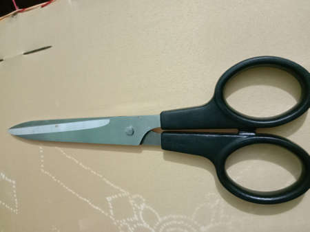silver and black colored scissors closeupの写真素材