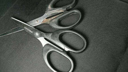 silver and black colored scissors closeupの写真素材