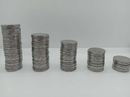 bangladeshi bank note and coin on white backgroundの写真素材