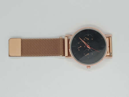 gray colored watch closeup on gray backgroundの写真素材