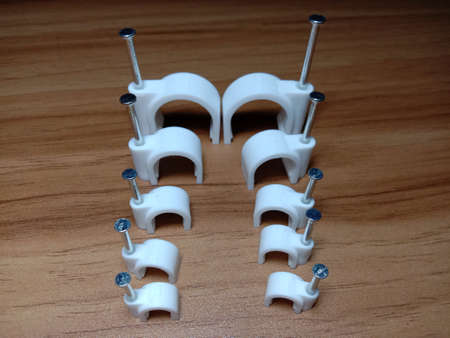 white colored wire pin on wooden tableの写真素材