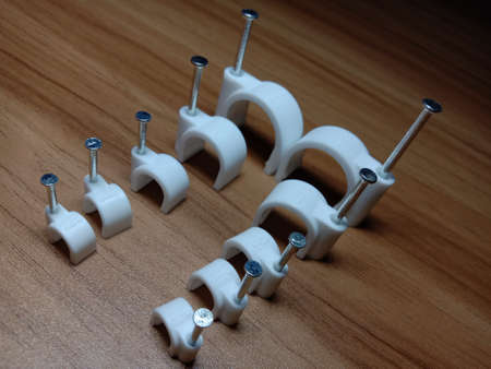 white colored wire pin on wooden tableの写真素材