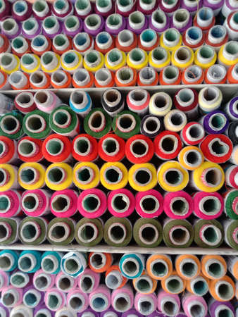 multiple colored yarn background on shopの写真素材