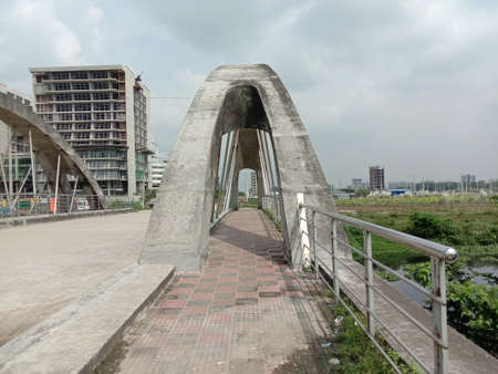 stylish steel and concrete bridge on lakeの写真素材