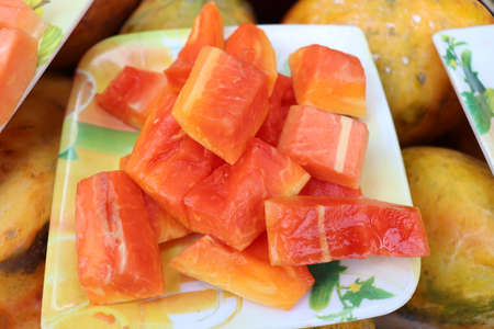 tasty and healthy colorful papaya cut peace stock for sellの写真素材
