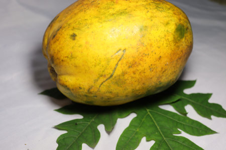 tasty and healthy colorful papaya closeup with leaf