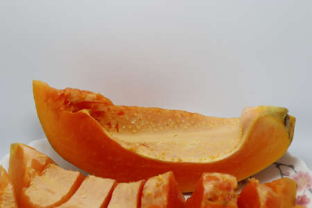 tasty and healthy colorful papaya cut peace closeupの写真素材