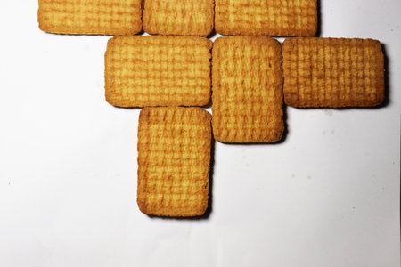 tasty and healthy brown colored biscuit stock on white backgroundの写真素材