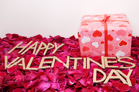 happy valentine"s day text on rose petal stuckの写真素材